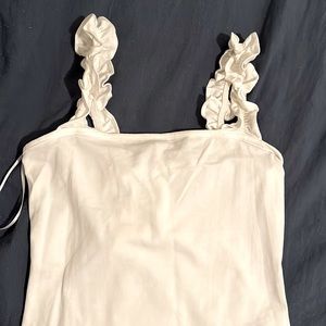 White body suit with ruffle straps